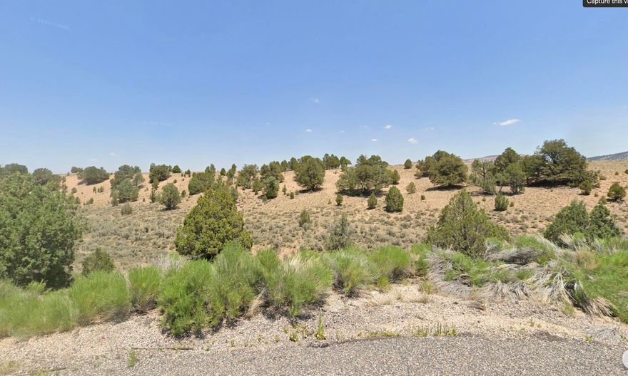 2.18-acre lot in Garfield County's only gated community. Roads, power, and water will be completed Spring 2025. Located on the Paunsaugunt Plateau at 7,000 ft, this property offers year-round paved access, scattered trees, and stunning views of Sunset Cliffs and Cedar Mountain. Just 15 minutes from Bryce Canyon. Horse-friendly, cabin-style community with short-term rentals allowed (with county approval).