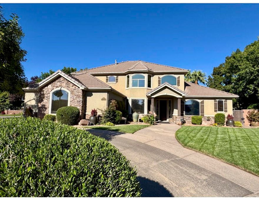 NOTHING LIKE IT IN SO. UTAH!!! This home is all character and fun...from the walnut library to the double slides of a Splash Mountain styled pool; a secret passage, sliding bookcases & hidden space to a cozy wood fire beneath the stars and canopies of beautiful trees. The 4 bedrooms, 3 1/2 baths, kitchen & great room, built in office, music room, bonus room and library will vie to pull your attention inside, from the granite boulder surrounded pool & spa, the dock, outdoor kitchen, roomy patio and fireplace, spiral stairs and balcony, shaded back lawn, and oversized & circular driveway on this corner lot. 
This beloved home has been maintained and cared for by its original family; full of solid wood cabinetry and floors, new ACs, water heaters, & constant attention to its details. Locate Located in Santa Clara, next to Sunbrook Golf Course, across the street from Arrowhead Elementary, walking distance to restaurants, city pool, schools, library, grocery stores, Summit gym and more!

DISCLAIMER: all future vacations will disappoint when compared to your every day life in your new home