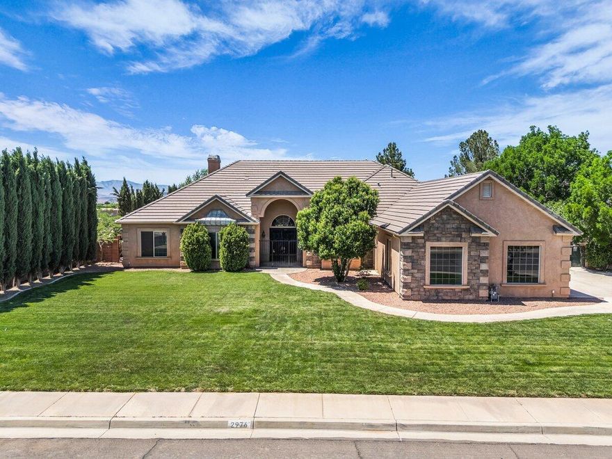 Experience elevated luxury living in this beautiful custom estate nestled on a breathtaking half-acre lot surrounded by mature landscaping, sweeping backyard views and gorgeous private pool. From the moment you enter, soaring vaulted ceilings create a grand and airy atmosphere that flows seamlessly through the entry, kitchen, and living spaces while filling the home with natural light. The thoughtfully designed gourmet kitchen showcases granite countertops, a wood-paneled refrigerator, double ovens, and beautiful custom finishes that blend timeless style with everyday functionality. Brand-new high-end flooring, solid core doors, designer hardware, and upgraded light fixtures add warmth, sophistication, and quality craftsmanship to every room. The oversized primary suite serves as a private retreat with a luxurious spa-like bathroom and generous space to unwind, while the versatile floorplan also offers a true formal dining room, a guest room that can be easily used as an office, and a private 4th bedroom featuring its own full ensuite bath. Step outside to your own resort-style backyard featuring a stunning pool, expansive open yard space, and views that create the perfect setting for entertaining or peaceful evenings at home. Completing the property is an oversized 4-car garage with ample room for vehicles, recreational toys, storage, and more! Buyer to verify all information, deemed reliable, however buyer to verify all info including utilities, rental restrictions, and HOA information if applicable.