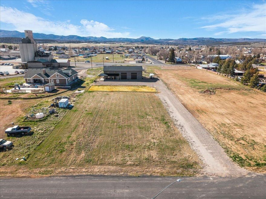 Don't miss this one of a kind opportunity in Enterprise! Built in 2023, enjoy the benefits of new construction, built with modern systems, materials, and energy efficiency. Expansive 1.01 acre lot, a rare opportunity in the core of Enterprise, the large parcel provides room for any outdoor lifestyle. This Shopdominium is so unique. 2240 square foot shop. Ready to go in any direction your heart desires. 14 ' automatic doors 40'deep 18' ceilings. Attached to a 1660 Sq Ft  2 Bed  2 1/2 bath condominium. Nicely upgraded, beautiful kitchen and master bedroom.  This property has endless possibilities.