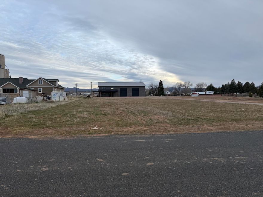 Don't miss this one of a kind opportunity in Enterprise! Built in 2023, enjoy the benefits of new construction, built with modern systems, materials, and energy efficiency. Expansive 1.01 acre lot, a rare opportunity in the core of Enterprise, the large parcel provides room for any outdoor lifestyle. This Shopdominium is so unique. 2240 square foot shop. Ready to go in any direction your heart desires. 14 ' automatic doors 40'deep 18' ceilings. Attached to a 1660 Sq Ft  2 Bed  2 1/2 bath condominium. Nicely upgraded, beautiful kitchen and master bedroom.  This property has endless possibilities.