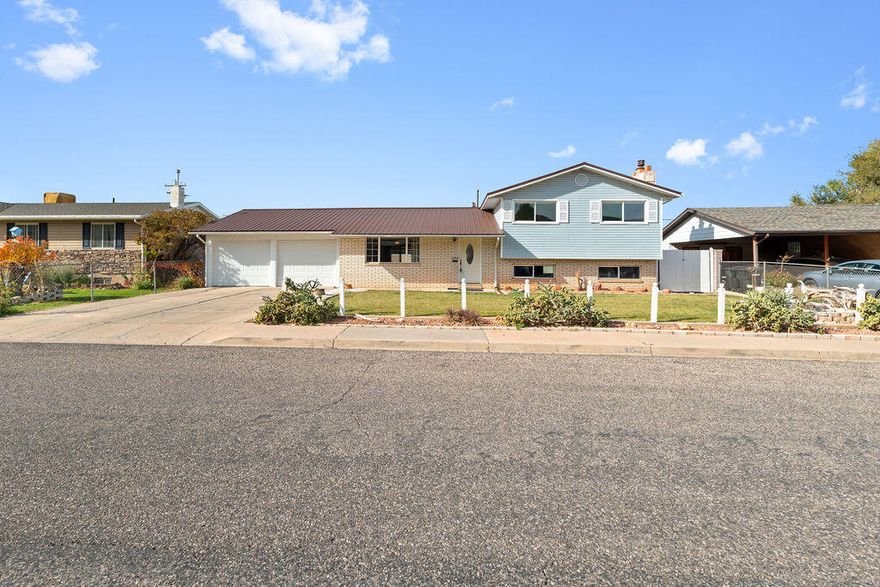 Wonderful family home in a great location, close to town. This home is a little slice of heaven with its well maintained fully fenced and landscaped yard. The versatile floorpan offers 4 beds 2 full baths, a nice sized living room, dining room off the kitchen, huge family room with fireplace, and lower level walk-out access to the backyard & garage. The laundry room has plenty of storage. Bonus room in basement could be used as an office, music room, man cave- you name it! The shop area at the back of the garage has power and its own access. The storage shed in the backyard will keep all your yard supplies tucked away. The large covered patio area is the perfect setting for all your summer gatherings. Don't miss out on this amazing home! Come take a look today!