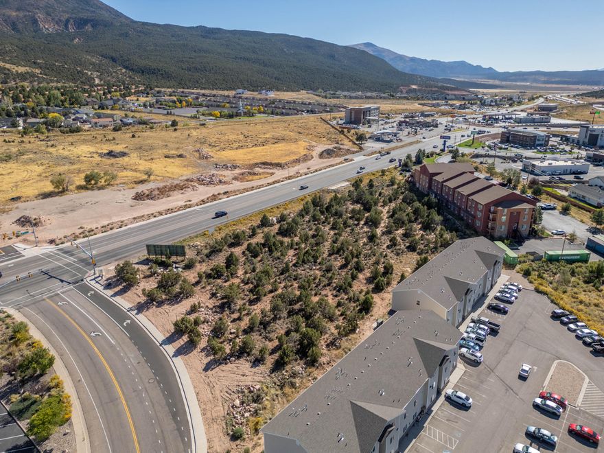 Come and look at this excellent commercial development site situated between two existing hotels that is just .25 of a mile from the I-15. This lot is located on a signalized corner of Cedar Main Street and Cedar Knolls which happens to be one of the busiest trade area within Iron County. Zoning is Central Commercial