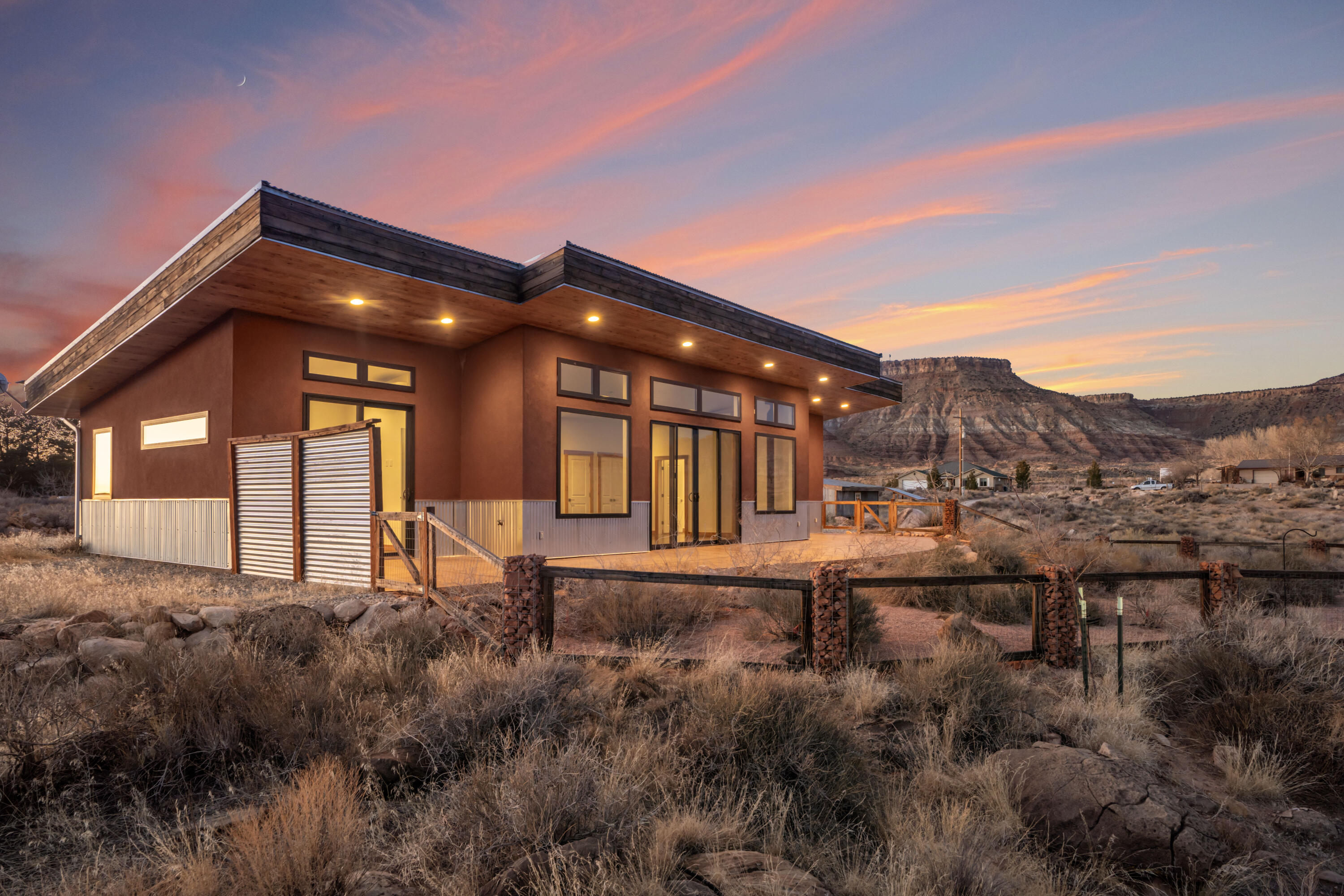 Welcome to your dream home in the heart of mountain biking paradise! This stunning property is perfectly located just minutes from southern Utah's world-renowned trails, including Gooseberry Mesa, JEM Trail, Hurricane Rim, and the iconic Red Bull Rampage site. Whether you're an avid cyclist or simply love the outdoors, this home offers unparalleled access to adventure.

Enjoy breathtaking views of Zion National Park and Kolob Canyon from every window, thoughtfully positioned to bring the beauty of the surrounding landscape indoors. Designed with energy efficiency in mind, the home features solar panels that keep utility costs impressively low.

Inside, you'll find two spacious bedrooms, each with exterior access and spectacular views, allowing you to wake up to the grandeur of Southern Utah every day. A versatile third bonus room offers endless possibilities as a home office, personal yoga studio, gear room, or bike roomperfectly tailored to your active lifestyle.

Step outside to discover a meticulously designed xeriscaped yard with raised garden beds, a convenient storage shed, a bike maintenance and wash station, and plenty of space to relax and enjoy the stunning surroundings.

Don't miss your opportunity to own your perfect escape from the cold winters, just minutes from the entrance to Zion National Park. This incredible home offers everything you need for a year-round retreat in one of the most sought-after outdoor destinations in the world!