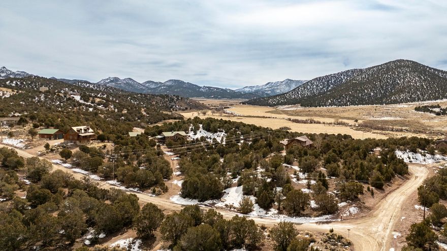 GREAT LOT in the BEST KEPT SECTRET subdivision of Old Irontown, nestled within the Dixie National Forest and only 25 miles west of Cedar City. Enjoy the tranquil atmosphere with its treed lots and beautiful views. This lot is walking distance to the historic ruins of Iron Town State Park along with it's preserved beehive charcoal kiln, walking trails and a private community pond that is stocked with fish for the homeowners to enjoy! The County maintains the roads which allows for easy year-round access. There is power run to the lot with underground wires so no overhead wires. Water is supplied by Oldiron town water company. The adjacent lot is also for sale. Seller will sell both together for $140,000. Buyer to verify all utilities.
