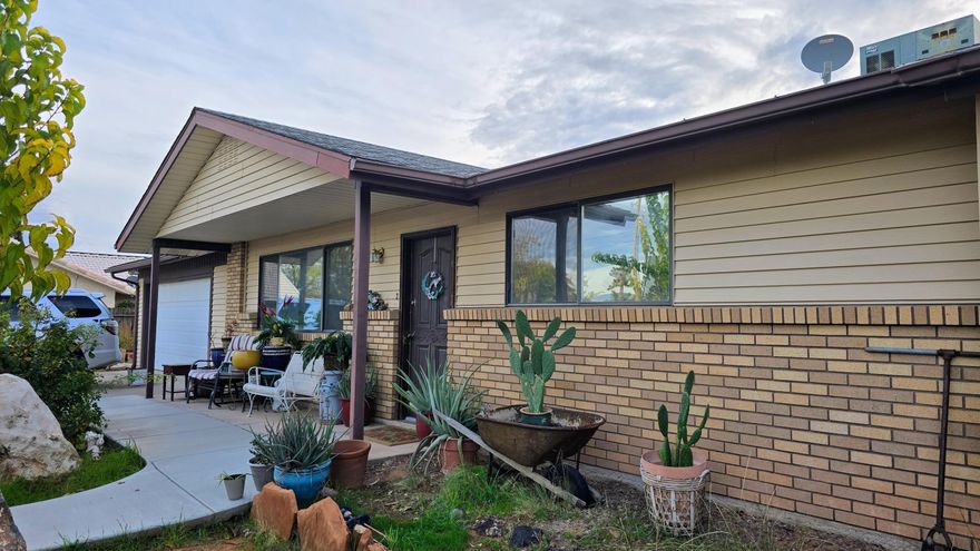 Big lot with 3 bedroom home has a fantastic view of the Pine Valley Mountain. Gated access to backyard from both sides of the home also features a 543 square foot 2 Car attached garage with roll up golf cart door on back of garage. In addition,to the attached garage, there is an 840 square foot detached ATV / Boat or 2 car garage which can also be used as a workshop.  A stuccoed10' x 12' stick built storage shed in backyard along with garden spot & dog run.