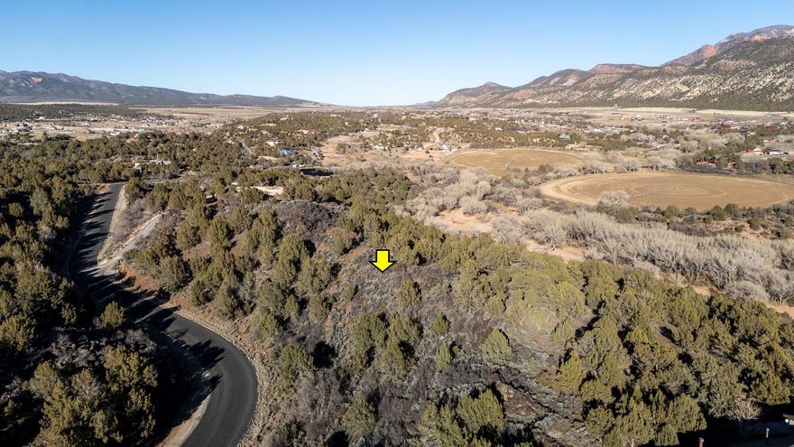 5 Acre view lot in New Harmony's Kolob Ranch Estates.  Views in every direction.  Zion National Park to the east, with Pine Valley Mountains to the west.  All of Harmony Valley north and south.  Conveniently located just minutes to St. George or Cedar.  All utilities in the street, with an acre share of water in the Mountain Spring Water Co.  This lot has some dirt work done. Backs to Ash Creek on the east and BLM to the West.  Very private lot with really incredible views and easy access to miles of trails.