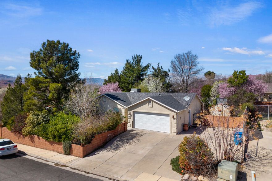Charming single-level home nestled in a quiet cul-de-sac in St. George. This 3-bedroom, 2-bathroom residence offers 1,279 sq ft of comfortable living space on a .18-acre lot with a functional and efficient floor plan. The home features a bright living area, a practical kitchen with ample cabinetry, and well-sized bedrooms throughout.
Step outside to enjoy the covered patio--perfect for relaxing or entertaining while staying cool during the warmer months. The property also includes a 2-car garage and easy-to-maintain outdoor space.
With no HOA and a convenient location near shopping, dining, parks, and several golf courses, this home offers flexibility and easy access to many of the amenities that make St. George living so desirable.
All property information, boundaries and documents to be verified by buyer.