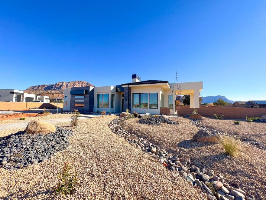 Discover this stunning residence, thoughtfully designed to capture the incredible views from its spacious 0.56-acre lot. Inside, the home impresses with soaring 14-foot ceilings throughout, creating a modern, bright, and open atmosphere in every room.

The full-size RV garage provides ample room for vehicles, storage, and recreational toys, making this home as practical as it is beautiful.  

With thoughtful upgrades throughout, this home seamlessly blends luxury living with everyday convenience—all while embracing the natural beauty of Apple Valley.