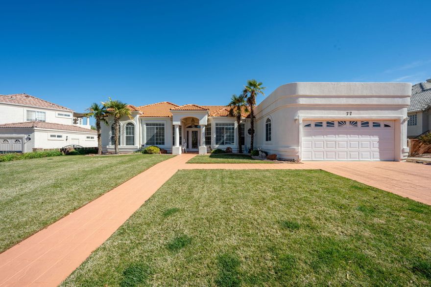 Beautiful single-level home in desirable neighborhood with great views and a bright, open layout. Large windows throughout bring in natural light and showcase the surrounding scenery. The spacious kitchen offers ample cabinetry and generous counter space, opening to the main living area for comfortable everyday living. A separate dining room with bay windows adds charm and plenty of space for gatherings. Enjoy outdoor living under the covered patio with scenic views, overlooking a backyard with a mix of lawn and low-maintenance desert landscaping. Additional highlights include spacious bedrooms, well-appointed bathrooms, a laundry room with built-in cabinetry, and great curb appeal. Conveniently located near shopping, dining, and recreation.