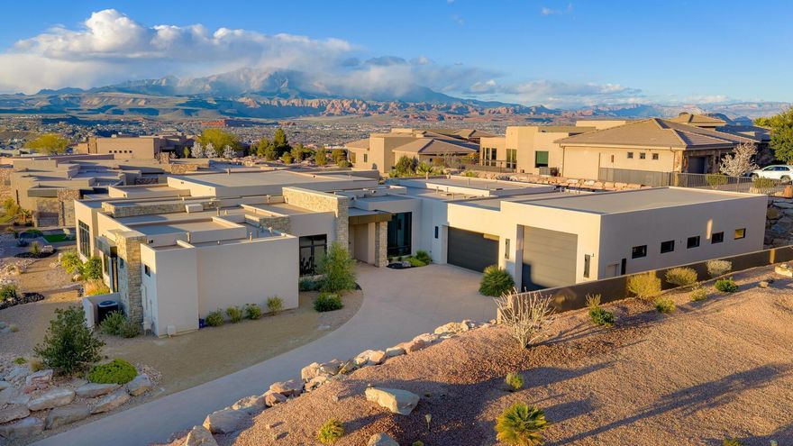 Experience luxury living at its finest in the exclusive Stone Cliff community with this truly one-of-a-kind estate. Nestled within the prestigious gated neighborhood, this extraordinary 6,000 sq. ft. single-level residence offers breathtaking views of Pine Mountain and St. George City below

From the moment you enter, you're welcomed by an atmosphere of refined elegance and timeless sophistication. The home showcases impeccable craftsmanship, designer finishes, and carefully curated details that elevate every space. The expansive, thoughtfully designed floor plan blends grandeur with comfort, creating seamless flow between the impressive living areas perfect for both elevated entertaining and relaxed everyday living.

Every element of this home reflects luxury, scale, and attention to detail, making it a rare opportunity in one of Southern Utah's most sought-after communities.

Car enthusiasts and collectors will appreciate the over 2,000 sq. ft. of garage space, offering abundant room for vehicles, storage, a private workshop, or all the recreational toys you can imagine.