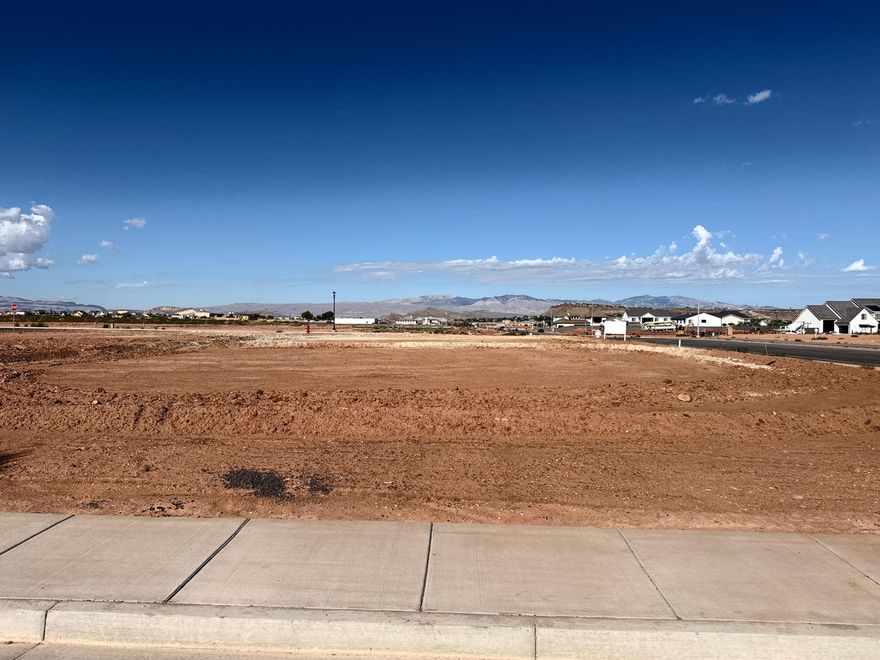 .25 acre lot in phase 1 of North Rim Farms subdivision. Located just 2 blocks from Crimson Cliffs High school. Use our custom builder or bring your own.