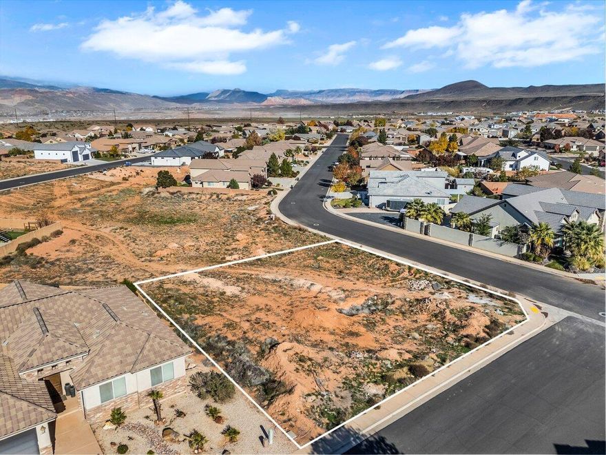 Build your dream home on this extremely rare, oversized corner lot in the coveted Dixie Springs community, where endless adventure and breathtaking scenery surround you. Connected Lot #169 (0.36 acre) and Lot #168 (0.3 acre) are also available for sale! This build-ready property offers stunning mountain views, no HOA, and utilities already at the lot, making it the perfect canvas for your custom home. Just minutes from Sand Hollow Reservoir, Sand Mountain dunes, and Dixie Springs Park, you'll enjoy year-round access to boating, off-roading, hiking, and pickleball. With direct side-by-side access from your own garage to a network of world-class trails, outdoor fun is always within reach. Plus, you're only a short drive from Zion National Park, top-rated golf courses, and iconic red rock landscapes, offering a lifestyle that blends recreation, convenience, and natural beauty all in one. Buyer to verify all information, deemed reliable, however buyer to verify all info including utilities, rental restrictions, and HOA information if applicable.