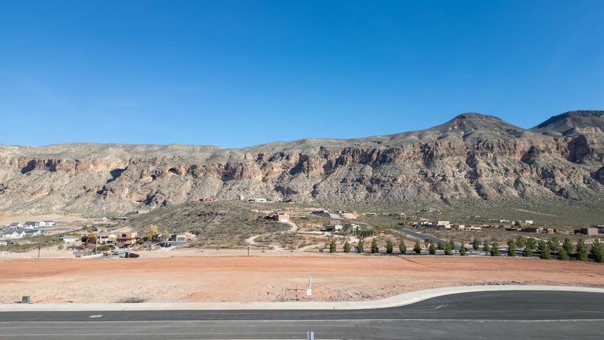 Build your dream home on this spacious 0.41-acre lot in the highly desirable Views at Hurricane Cliffs community. Surrounded by Southern Utah's iconic red rock landscapes, this premium homesite offers breathtaking panoramic views and a peaceful setting while still being just minutes from shopping, dining, and everyday conveniences in Hurricane.
Outdoor enthusiasts will love the close proximity to world-class recreation including hiking, biking, golf, and off-roading trails, along with easy access to nearby destinations like Zion National Park and Sand Hollow State Park.

Don't miss this opportunity to secure a premium lot in one of Southern Utah's most scenic settings and bring your vision to life at The Views at Hurricane Cliffs.
