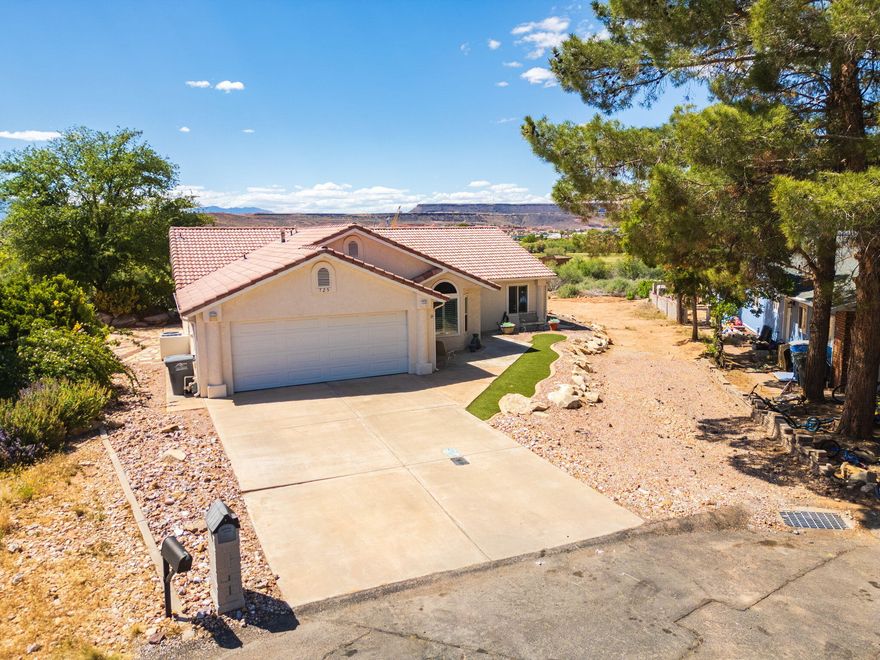 Enjoy peaceful, low-maintenance living in this beautifully updated single-level home tucked away in a quiet cul-de-sac with breathtaking golf course, mountain, and downtown temple views. Backing directly to the city walking trail system with no homes behind, this property offers exceptional privacy along with incredible scenery from both the backyard and main living areas. Inside, you'll find vaulted ceilings, new plantation shutters, new windows, tile flooring, and two spacious living room areas with the potential to add a third bedroom if desired. The kitchen is thoughtfully designed with abundant cabinetry, a built-in desk area, new microwave, and exceptional storage space throughout. The oversized primary suite features a brand-new slider to the patio, a remodeled walk-in shower, dual vanities, linen storage, and a large walk-in closet, creating the perfect private retreat. A built-in Murphy bed adds flexibility for guests, hobbies, or a home office setup, while the rear sunroom features brand-new remote-controlled blinds for added comfort and convenience. Additional upgrades include central vac, water softener, a 2020 water heater, high-end exterior paint, artificial turf and low-maintenance landscaping in both the front and back yards, plus an oversized 2-car garage with built-in cabinetry. Located in a highly desirable area with great neighbors, excellent schools nearby, and the added benefit of Dixie Power utility rates, this home truly offers comfort, convenience, and incredible views in every direction. Buyer to verify all information, deemed reliable; however, buyer to verify all info including utilities, rental restrictions, and HOA information if applicable.