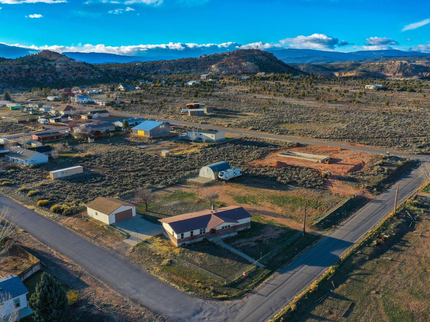 Freshly painted main level & upgraded LVP flooring throughout. Spacious 5-Bedroom, 2 bath Home with modern upgrades and Ample Storage in Escalante Welcome to this beautifully updated 5-bedroom, 2-bathroom home nestled in the heart of Escalante. Designed for comfort and functionality, this home boasts two expansive family rooms and a formal dining area, perfect for both everyday living and entertaining guests. The modern kitchen is a chef's dream, featuring sleek granite countertops, black stainless steel appliances, and ample cabinetry. With furnishings included, this home is move-in ready, offering a seamless transition for its new owners. Situated on two generous 0.38-acre lots, the property provides abundant outdoor space to accommodate all your recreational needs. The detached 28x34 garage offers substantial room for vehicles and storage, while the additional 24x32 metal Quonset presents versatile options for workshops, equipment storage, or hobby spaces. Experience the perfect blend of modern amenities and spacious living in this exceptional Escalante property. Square footage figures are provided as a courtesy estimate only and were obtained from county records. Buyer is advised to obtain an independent measurement. Buyer and Buyer's Agent to verify all information.
"This home is covered by a SilverBack Home Warranty Listing Policy which can be transferred to the buyer at
closing with the purchase of a Buyer's Policy" to Agent Remarks on the MLS Listing.