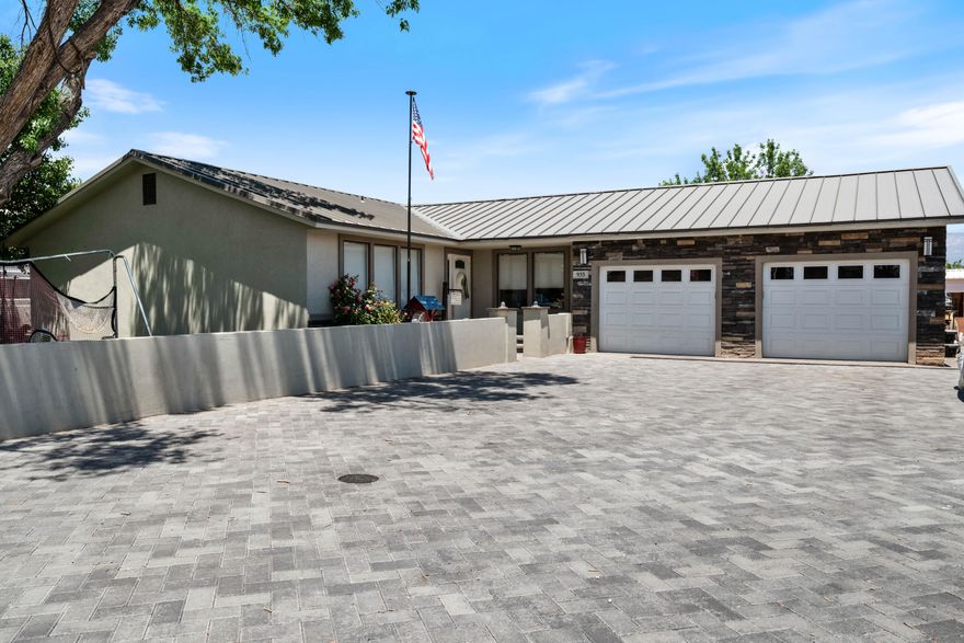 Come see this charming ranch-style home nestled in the Bloomington Hills neighborhood. Featuring 5 spacious bedrooms, 3 baths, and 2,064 SQ FT of inviting living space, this home offers comfort, charm, and function. Enjoy the natural light and two large living areas. The kitchen boasts stainless appliances and opens to a generous covered deck perfect for relaxing or entertaining. Recent upgrades include a brand-new metal roof, AC unit (plus garage AC), fresh paint, and landscaping pavers in front and back. Close to shopping, restaurants, medical, schools, parks, and low Dixie Power utilities make it even better! NO HOA.