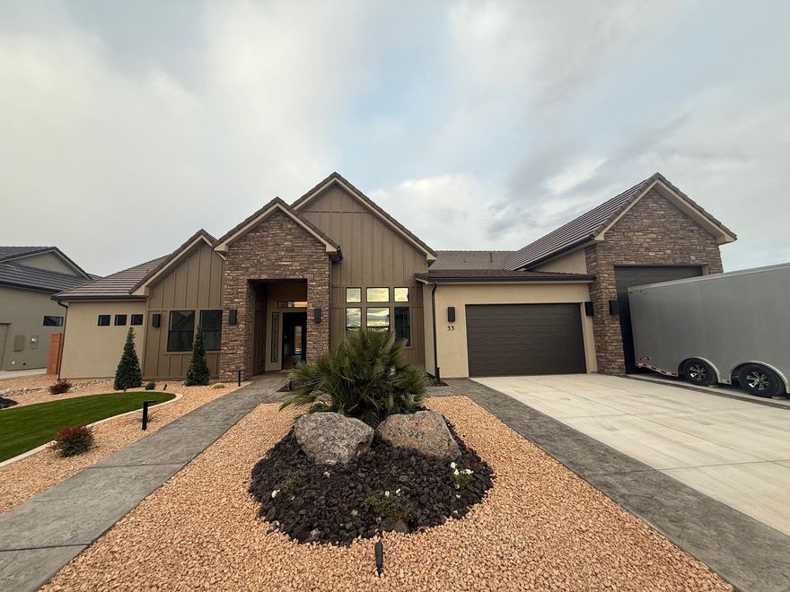 Gorgeous gable-style home: Large lot, 20x40 pool, giant slider in the great room, beautiful view, epoxy garage floor, wired for surround in the great room, and a 42.8 ft deep RV garage with RV parking on the side. The floor plan is open and light. The finishes are high-quality and beautiful: stunning iron door, combo of painted and knotty alder cabinets, gorgeous quartz countertops, GE CAFE appliances, and Delta plumbing fixtures. Close to hiking and biking trails.