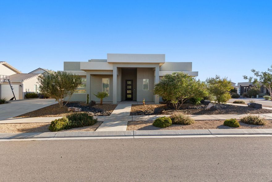 This well maintained part-time home sits in the heart of Desert Color, one of Southern Utah's most active and convenient communities. As a second home, it's been gently lived in and feels better than new, with upgrades that make a real difference day to day.

The home has a clean, modern elevation and a fully desert-scaped yard for minimal upkeep—perfect if you want the look without the work. Inside, you'll notice the high ceilings and tall doors that make the home feel open and bright. The refrigerator/freezer, washer, dryer, and water softener are all included. Custom roller window shades and a tray ceiling in the main living area add a polished touch.

The primary suite is private and comfortable, and the additional bedrooms are great for guests, each with its own walk-in closet. Outside, there's room to add an RV garage if you need more storage or flexibility down the road.

Desert Color has an unbeatable vibe; community events, restaurants, trails, and of course, the 2.5 acre lagoon. There's plenty more on the way too, including Costco, a movie theater, a car wash, and more. It's the kind of place where you can stay busy or simply relax and enjoy the lifestyle.