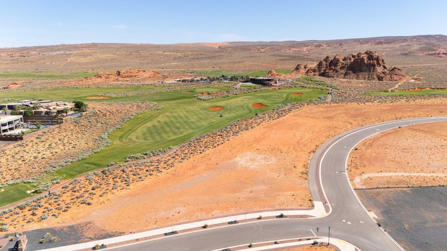 A beautifully proportioned homesite in the heart of Southern Utah's finest community. Lot 47 is one of the widest and most generously proportioned homesites available at The Estates at Sand Hollow Resort, and its position is exceptional. Sitting between the Hole 17 green and the Hole 18 tee box on the Championship Course, this 0.72-acre lot places you front and center as golfers make their final approach before stepping to the tee on one of the most anticipated closing holes at Sand Hollow, one of Golfweek's Top 50 Resort Courses in the United States. The wide lot dimensions allow for an expansive main residence, resort-style pool, casita, and oversized garages without compromise.



The Estates has hosted multiple Parade of Homes  with showcase homes selling to buyers who recognize this as Southern Utah's premier address. A new regional hospital, new Hurricane schools, and two destination resort developments with water parks are all underway nearby, adding long-term value to an already exceptional investment. Sand Hollow State Park is directly across the street. Zion National Park is under an hour. Brian Head Ski Resort and Lake Powell are within easy reach.

Ownership includes 40% off Championship Course green fees, discounts at The Grille, the Pro Shop, and 10% off Mad Moose UTV rentals. HOA covers landscaping and hourly security patrol. Premier approved builders available or bring your own. 15 minutes to St. George Airport. 90 minutes to Las Vegas.