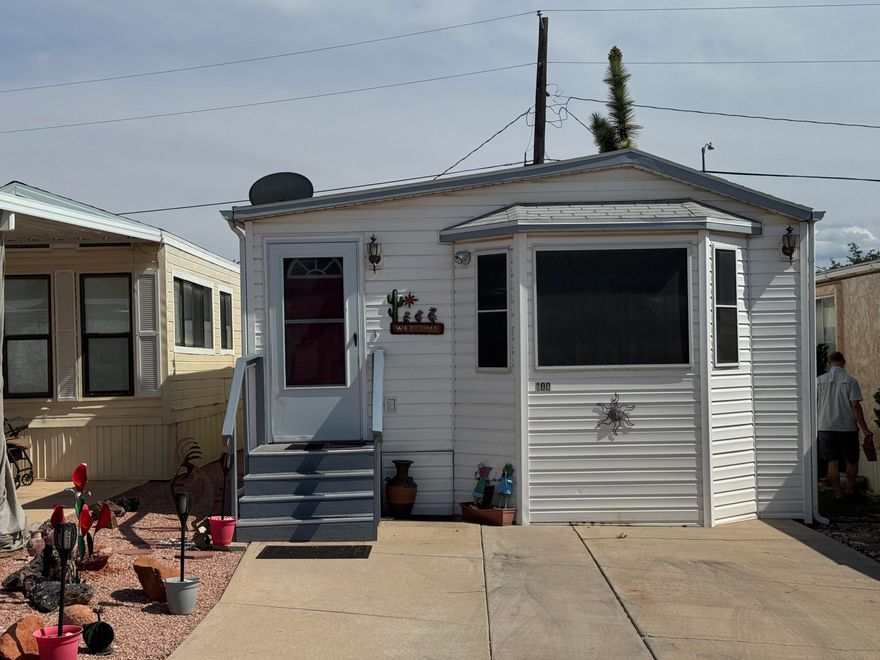 Bright, Happy & Move-In Ready at Dixie Downs Unit 100! Step into a home that radiates warmth and charm. Since 2018, thoughtful updates have transformed this space into a cozy haven: a stylish ceiling beam spans the main living area, new lighting throughout (no more fluorescent!), and a fresh kitchen with new paint, backsplash, tile, and flooring. You'll love the refinished TV cabinet, updated bathroom with new shower and toilet, and the bright, cheerful bedroom. Major systems are covered too...new air conditioner, furnace, and refrigerator keep things cool and comfortable. Outside, the front and back stairs have been redone, the back awning adds shade, and the propane tank has been neatly boxed in. Bonus: electric in the shed and a fresh water filter in the kitchen for peace of mind. This home is ready for your next chapter...don't miss it! Park model on owned lot! Buyer to verify all information.