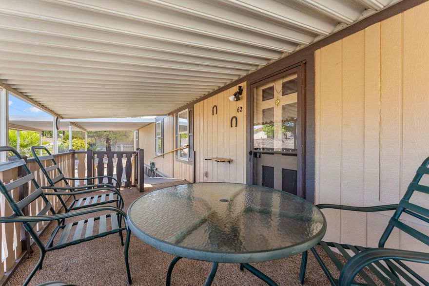 Come see this incredibly affordable home on one of the best lots in the Paradise Palms mobile home community. This lot sits parallel to the road allowing more parking and outdoor space. The community is exceptionally well maintained and clean, perfect for the buyer looking for a quiet and peaceful escape from everyday life. Paradise Palms is a 55+ community. You'll notice the thoughtful addition of the awnings covering the front porch and parking area. Brand new carpet has been added to the bedrooms! This is a functional, easy to maintain space that is waiting for a new owner's touch!