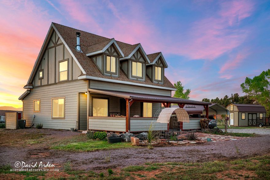 Welcome to a place where the pace slows and the views stretch endlessly across Southern Utah's stunning landscape. Nestled in the quiet beauty of Apple Valley, this lovingly maintained home invites you to breathe deeper, relax longer, and truly feel at home. Each day begins with mountain vistas painted in morning light and ends with unforgettable desert sunsets. With over an acre of land, the backyard becomes your personal retreat. Imagine gatherings under open skies, evenings by the firepit, space for gardens, play, or simply the luxury of room to roam. Inside, natural light pours into warm, comfortable living spaces designed for both connection and quiet moments. Every room feels welcoming, creating an atmosphere that is as peaceful as the surroundings. This is more than a home - it's a lifestyle of space, serenity, and spectacular scenery.