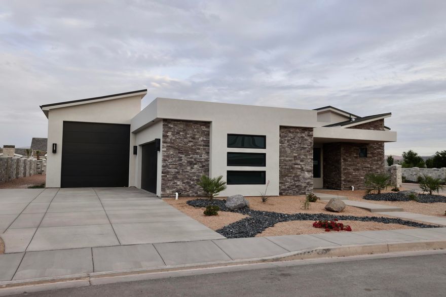 Hawkeye Point in Washington City is close to EVERYTHING! Just minutes from Downtown St. George, Tuacahn entertainment to the west and Sand Hollow and the sand dunes to the east.  Located in the middle of it all. Whether it's hiking, biking, camping, water and off-road recreation, theater, shopping and dining or simply peaceful scenic walks, there is something for everyone at Hawkeye Point. Our modern floor plans with RV garages are perfect for the on-the-go lifestyle. Our standards include upscale kitchens, open layouts with ample room for entertaining and a sophisticated owners su