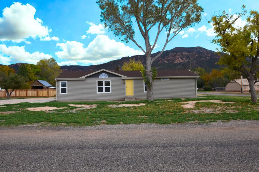 This cute and quaint 4-bedroom, 2-bath home is full of charm and comfort. It features a cozy layout, a bright kitchen, and a 3-car carport with a shop attached. Perfect for easy living, this home is a great option for small town living. Enjoy peace of mind with a new roof, fresh paint, new siding, and updated flooring throughout.