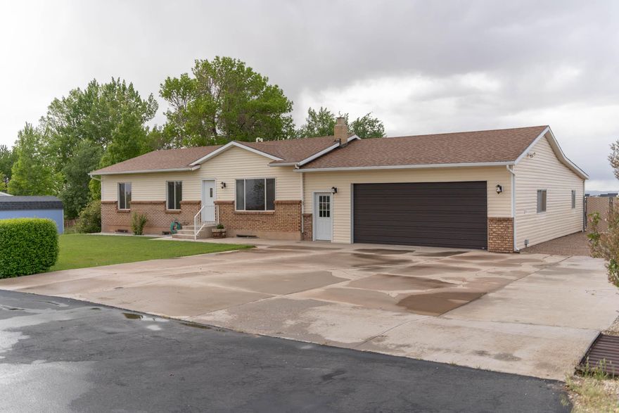 This home has a layout perfect for families or those who enjoy entertaining. With four bedrooms and three bathrooms, there's ample space for everyone. The property sits on a generous 0.67-acre lot, providing plenty of outdoor space with a large outdoor patio area. The two-car garage with an attached workshop is perfect for hobbyists or additional storage needs. A standout feature is the second kitchen, conveniently located off the dining room, equipped with a high-quality Wolfe grill connected to propane gas—ideal for those who love to cook and entertain. The basement is set-up for a wood burning stove. Recent updates, including a new water heater, updated AC, new furnace, and roof replacement within the last two years, ensure a worry-free living experience.