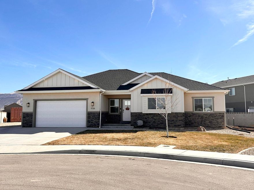 Better than new and built for flexibility, space, and toys. This newer 6-bedroom, 3-bath home offers exceptional versatility with main kitchen & basement kitchenette, including a fully finished basement ideal for multi-generational living, rental income, or extended guests. Situated on a .35-acre lot, the property features full RV hookups, a 220-amp garage service ready for heavy equipment or EV charging, and permanent LED Christmas lights for effortless year-round curb appeal. Enjoy fruit trees, generous fully landscaped outdoor space, and thoughtful upgrades throughout. Whether you need room to spread out, space to host, or the ability to live and earn under one roof—this home delivers.