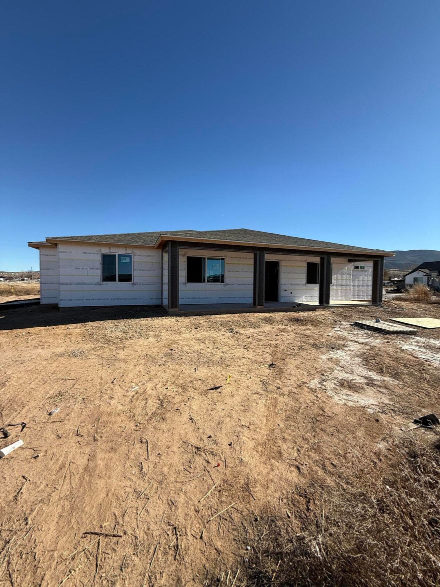 Brand New Single-Level Home with Stunning Mountain Views! Welcome home to this beautifully crafted 4 bedroom, 2 bathroom rambler featuring a spacious 3-car garage and thoughtfully designed no-stairs, single-level living. Located in a quiet, scenic neighborhood, this home offers an ideal blend of comfort, style, and low-maintenance convenience. Step inside to find gorgeous tile flooring, granite countertops, and an open-concept layout perfect for both everyday living and entertaining.The bright, modern kitchen flows seamlessly into the living and dining areas, all framed by incredible mountain views right out your windows.The primary suite offers a peaceful retreat with a walk-in closet and beautifully finished bathroom. Three additional bedrooms provide flexible space for Family to enjoy.