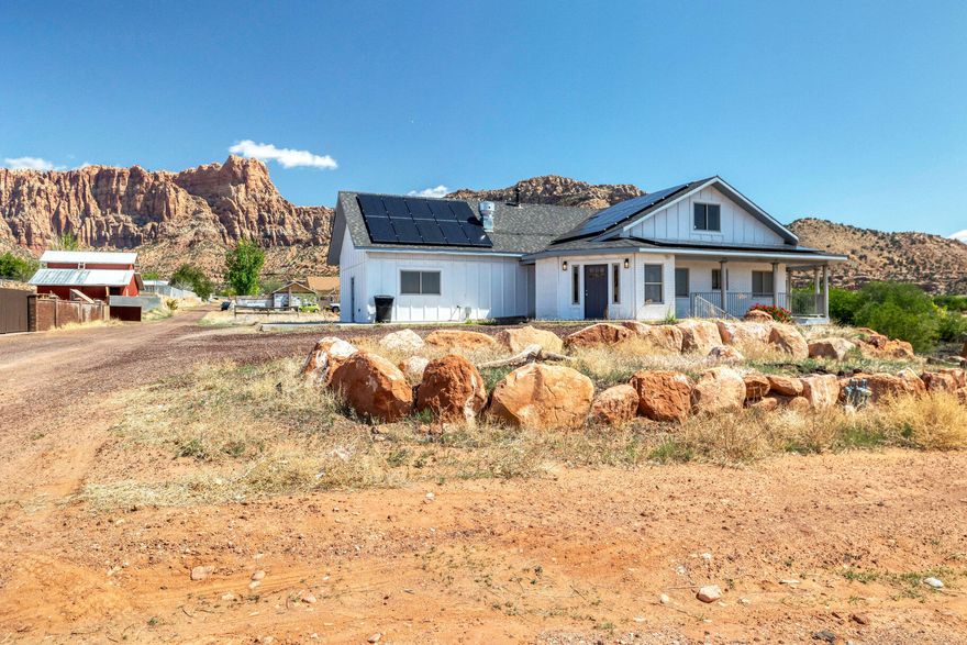 Discover a unique investment opportunity in the breathtaking red rock landscapes of Hildale, Utah—a community undergoing rapid revitalization and growth. Once a large single-family home, this spacious property has been thoughtfully re-zoned and remodeled into a legal multi-family residence. It now features two 3-bedroom, 2-bath units and a studio, 1-bath unit, each with its own entrance and rental potential. Whether you're seeking a steady income property, multi-generational housing, or a mix of both, this home offers flexibility, function, and opportunity. Hildale's rich history is evolving, and this property is perfectly positioned to be part of its next chapter.