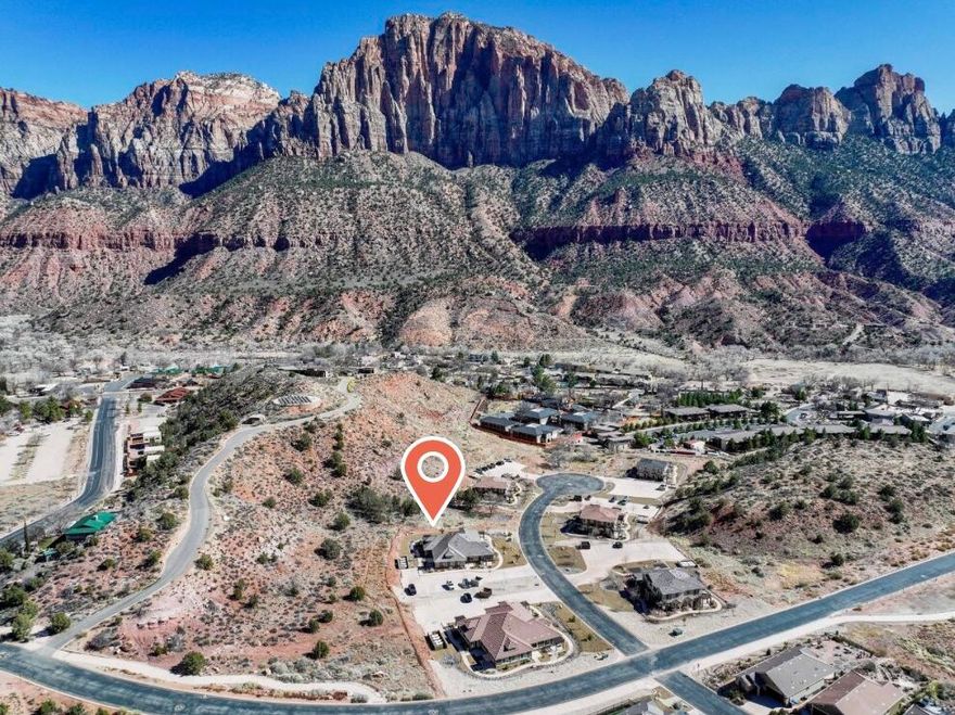 PRICE IMPROVEMENT!! The Zion Retreat you've been looking for! Nestled in the tranquil Moenave community, just half a mile from the entrance of Zion National Park, this stunning home offers breathtaking, unobstructed views of The Watchman and West Temple mountains.
With expansive windows and 9' ceilings natural light fills every corner, ensuring you're surrounded by breathtaking scenery from every room.
The thoughtfully designed floor plan provides an inviting and spacious living area. The kitchen features a large island, granite countertops, subway tile backsplash, and custom cabinetry with crown molding, glass accents, and under-cabinet lighting. Stainless steel appliances, including a gas (propane) range and side-by-side refrigerator with water and ice dispenser, complete the space. The covered patio off the dining area creates a tranquil outdoor living space.
Luxury vinyl flooring flows throughout the main living areas, complemented by recessed lighting. Bathrooms feature tile flooring, tile shower surrounds with glass doors, and granite countertops, adding to the home's refined design. 
This home is like brand new, having only been stayed in for 2 or 3 weekends. ALL FURNISHINGS INCLUDED, making a seamless transition into your move-in-ready retreat.
Built with high-quality, energy-efficient features, including 2x6 exterior walls, blown-in insulation (R50 attic / R23-25 walls), Low-E windows, a 95+% efficient furnace, and a tankless water heater, this home offers both comfort and sustainability.
Located at the heart of Springdale, and in walking distance from its shops and restaurants with an abundance of stunning hiking and biking option, this home is the perfect blend of luxury, convenience, and breathtaking, natural beauty. Everything you dreamed your Zion Retreat would be, and more!
Springdale does not allow overnight rentals. Long term rentals are allowed at a minimum of 60 days. Note* There are a few photos labeled as being of Unit A. All other interior photos are of Unit C, which has a different interior color palette, but is the exact same layout as Unit A. All information provided as a courtesy. Buyer to verify all.