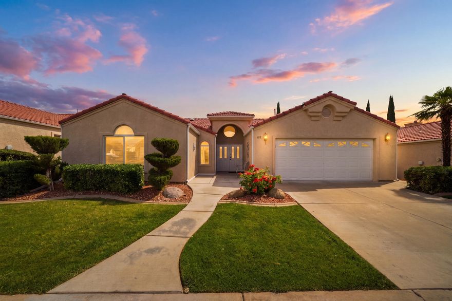 Beautifully maintained 3 bed, 2 bath home in one of the best locations within the community -- directly across from the incredible HOA amenities! Enjoy true low-maintenance living with indoor & outdoor pools, clubhouse, fitness center, sports courts, hot tub, clubhouse, and more just steps from your front door. This single-level home offers an open, functional layout with vaulted ceilings, spacious living areas, and abundant natural light. Recent upgrades include a brand new washer & dryer, new microwave, and extended concrete on the back patio creating the perfect space to relax or entertain outdoors. The attached garage and HOA-maintained exterior make this an ideal full-time residence, second home, or lock-and-leave property. Located in an established west-side St. George community close to shopping, dining, parks, golf, and everything Southern Utah has to offer.