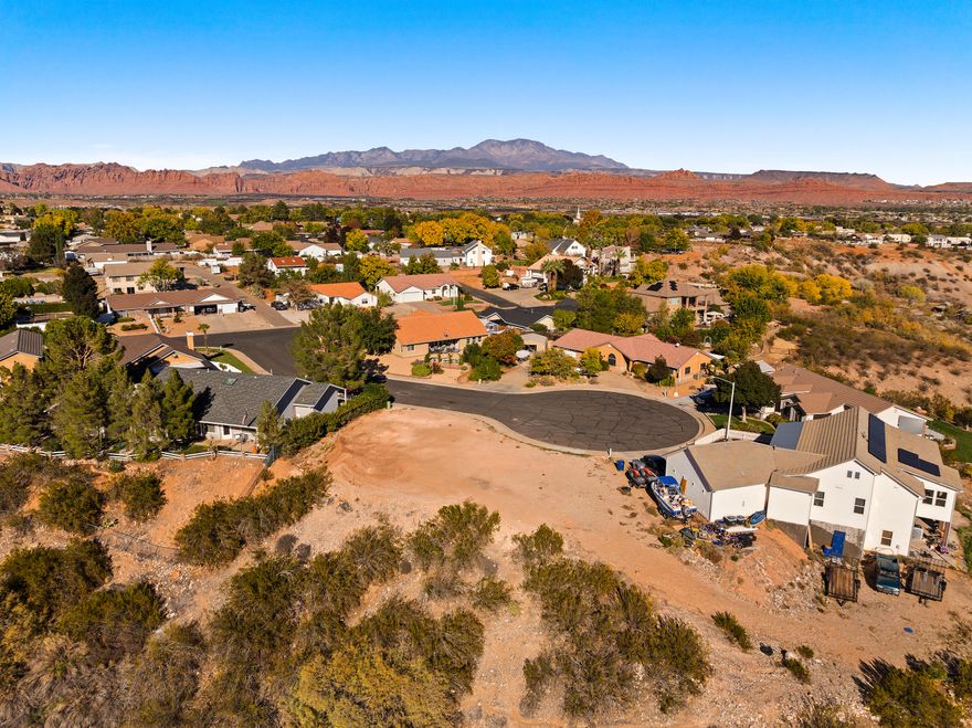 Attention: Specialized Lot with Significant Geotechnical Challenges - Engineering Review Required. This lot is priced to reflect documented slope stability issues that may prevent conventional residential development. Two geotechnical engineering reports (2002 AGEC, 2018 Landmark) are available and MUST be reviewed by prospective buyers. The 2018 analysis indicates the slope does not meet minimum safety factors and may not support standard residential construction even with mitigation. Buyers must retain their own geotechnical engineer to verify IF and HOW this lot can be developed prior to closing. Property sold AS-IS. That said - stunning unobstructed views of mountains, knolls, green Santa Clara River valley farmlands, and historic Jacob Hamblin Home. Cul-de-sac location near Santa Clara Elementary. Potential opportunity for creative buyer willing to explore specialized engineering solutions. Both reports available for immediate review. Buyer must independently verify all information and buildability.