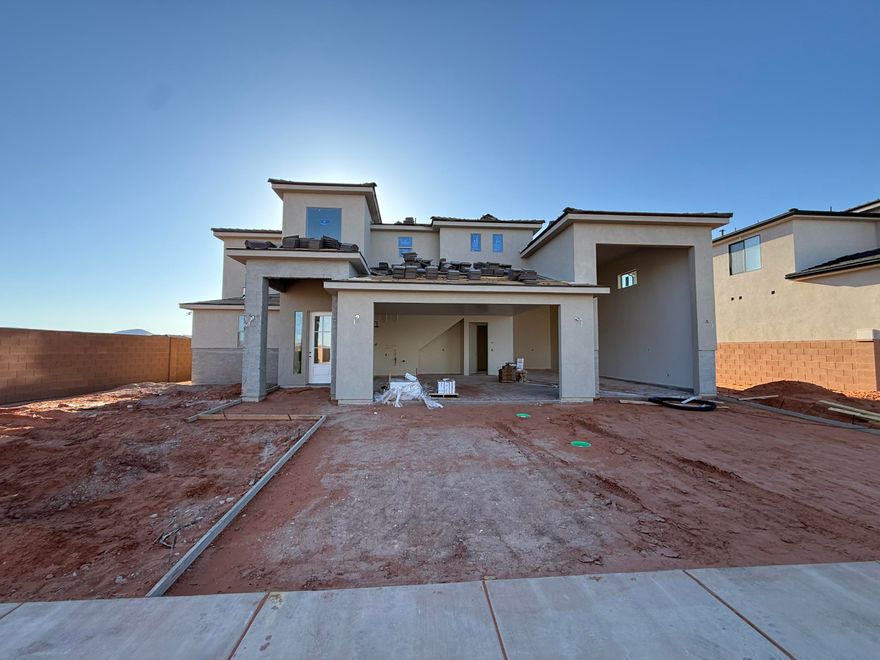New Floorplan Alert!!! Welcome to your next home in Sand Hollow! This thoughtfully designed 2-story residence offers 2,744 SQFT of highly functional living space, perfect for both everyday comfort and entertaining. Featuring a highly sought-after RV garage, there's plenty of room for all your toys and storage needs.

Step inside to discover a gourmet kitchen with elevated finishes throughout, highlighted by a massive island that serves as the heart of the home--ideal for gatherings, meal prep, and making memories. The open-concept layout flows seamlessly to a large covered patio, creating the perfect indoor-outdoor living experience.

Upstairs, you'll find a spacious loft centrally located between the bedrooms, offering a versatile second living area, media space, or playroom. Every detail of this home has been designed with functionality and style in mind.

Enjoy unbeatable access to Southern Utah's outdoor lifestyle with Sand Hollow State Park just minutes away--offering boating, off-roading, hiking, and endless adventure right at your doorstep.

This is a home you won't want to miss!