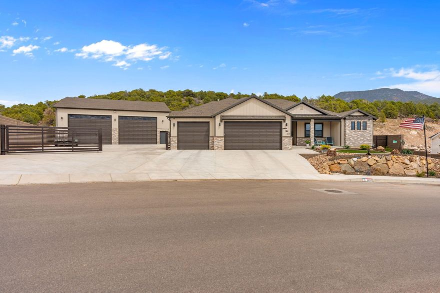Better than new and beautifully designed, this stunning home offers both comfort and style throughout. The thoughtfully crafted interior features 4 spacious bedrooms, 3 of which is complete with its own connected bathroom, providing privacy and convenience. The oversized master suite is a true retreat, complete with a luxurious bathroom and an expansive closet. Enjoy low-maintenance, water-wise landscaping that keeps upkeep simple year-round. The impressive 2,954 sq ft detached garage includes a fully finished man cave, bathroom, and loft--currently set up as a gym and sauna. Plus, you'll enjoy lasting privacy with no backyard neighbors, as the rear is permanently designated green space.