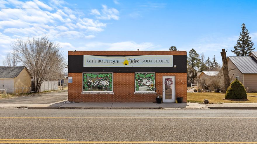 Great commercial building and centrally located available for purchase in Enterprise, Utah. Building is 1,106 sqft with large 0.36 acre lot with plenty of parking available behind the building. Previous business use includes post office, pizza restaurant, pawn shop, and currently a boutique shop. Centrally located on Main street across from Carter's market (grocery) and the pharmacy. Consider building out office spaces for lease or anything else you can imagine. Schedule a showing today.