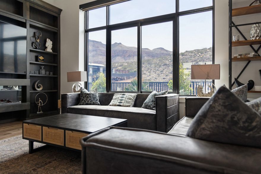 On the backdrop of the Copper Rock Championship Golf Course with stunning mountain views of the Hurricane Hills, Pine Valley, and the most stunning desert landscaping lies this modern-style short term rental home. Showcased as one of the homes in the 2022 Parade of Homes, this custom-built turnkey fully furnished stunner was designed for both aesthetic impact and practical living. Overall, the residence features 5 bedrooms, 5 bathrooms, 3 car garage (1,045 SqFt) with 14' ceilings and 10' bay door, over 50 solar panels with a power wall. The unique layout brings together a main residence and a guest house feel. The main house is 3 beds with 3 baths, and the detached guest house has 2 beds with 2 baths with a kitchen and living space. The main house includes a spacious great room that features 12' ceilings, large built-in entertainment center with a fireplace, tall windows, spectacular contemporary design light fixtures, large kitchen islands with Bianco Romano Granite countertop, Bertazzoni high-end Italian Appliances, two-tone cabinets, electronic blinds throughout, dedicated room-by-room mini split heating/cooling air conditioner units,  exquisite tile, LVP, and carpet throughout, and all of the most amazing upgrades. The exterior space is designed to entertain and absorb the beauty of the surrounding landscape with features like an inground pool with shamu shelf, built-in BBQ, artificial turf, pergola, upper view deck with a hot tub above the main house, additional upper deck above the guest house, and so many more details. Constructed with Insulated Concrete Forms (ICF), the home boasts an impressive R-54 insulation rating, contributing to low utility costs and increased rental profitability.
 
Situated on the foothills of the Hurricane Cliffs, just steps from the acclaimed Copper Rock Golf Course, this home enjoys a front-row seat to one of Southern Utah's finest championship courses. Copper Rock features 18 masterfully designed holes with sweeping desert views and has proudly hosted multiple LPGA and Epson Tour events, including the Copper Rock Championship. Adventure abounds beyond the fairwaysjust a short drive from the home, you'll find thousands of acres of red rock terrain, massive sand dunes, and ATV/OHV trail systems that connect to Sand Hollow Reservoir. The region is a haven for outdoor lovers with world-class mountain biking, hiking, and rock climbing. It's also home to major events, such as the Ironman World Championship, Red Bull Rampage, and more. Only a short drive away, explore the grandeur of Zion National Park, Bryce Canyon, the North Rim of the Grand Canyon, and nearby reservoirs like Quail Creek and Gunlock. Set at just over 3,000 feet above sea level where the Mojave Desert, Colorado Plateau, and Great Basin converge, this is truly one of the most striking and geologically unique regions in the country.
There's nothing else like itschedule your private showing today and experience a home that truly captures the soul of Southern Utah.((All information herein is deemed reliable but is not guaranteed. The buyer is responsible to verify all listing information, including square feet/acreage, to the buyer's own satisfaction.