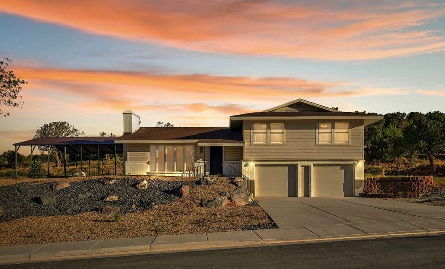 Endless potential await in this 4-bed, 2.5-bath home on a rare .55-acre elevated lot next to Black Sage. Freshly painted exterior, tandem 2-car garage, and zoning allows an ADU, workshop, or RV garage. Large picture windows frame the Shurtz Canyon backdrop, with 2 wood-burning stoves, both set against a floor-to-ceiling stone wall. The kitchen offers solid wood cabinets, granite counters, and black appliances. A steel-framed covered side patio is perfect for year-round use. The lower level features rustic finishes, barn doors, and bonus living spaces. Spacious bedrooms capture mountain views. Minutes from Providence Center, downtown, local trails, I-15, & Utah's Parks, this is a prime opportunity to secure a home in a neighborhood poised for rapid equity growth.