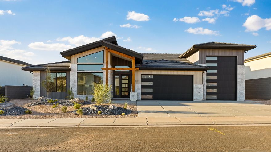 This stunning home offers breathtaking views and is loaded with premium upgrades throughout. Enjoy a fully insulated garage with its own heating and cooling system, solid interior doors, and upgraded cabinets, countertops, and flooring—every detail has been thoughtfully designed. Perfectly situated just 5 minutes from Sand Hollow State Park, you'll have easy access to golfing, swimming, sand dunes, and rock crawling. Plus, you're only minutes from Jellystone and Pecan Valley Resort! Whether you're looking for a forever home or the ultimate vacation getaway, this property delivers it all.