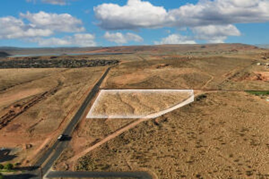 Directly on the corner of Sand Hollow Rd and Turf Sod Rd. This undeveloped land is on the main intersection for the biggest development in Southern Utah and has incredible views.  Within less than 5 miles of this land there are dozens of residential developments, 2 Reservoirs, Coral Pink sand dunes, Jelly stone RV Resort, Pecan Valley Resort, and more. Prime land development and future growth.