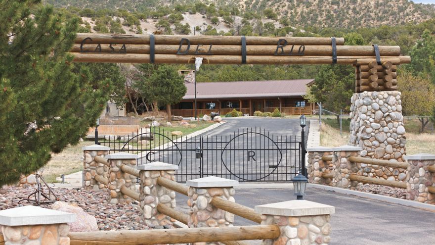 Set on approximately 13.9 acres on the east side of Parowan, this expansive residential property offers a rare combination of acreage, custom log home, guest house, and multi outbuildings including a pool house. A true compound with privacy, and proximity to town services. The roughly 6956 +/- square-foot residence, mostly built in 1983, features single-level living with a finished basement, two full baths and two half and one 3/4 bathrooms, additionally 4 fireplaces that add warmth and character throughout the home and guest house.
The property also includes garden beds and a fenced apple orchard. The location lies east of State Route 143, providing convenient access toward Brian Head Resort and Southern Utah's many year-round recreation areas. The generous acreage creates a unique setting seldom found within Parowan City limits, offering space to spread out while remaining close to schools, highways, and local amenities.
Long-term versatility and an uncommon land-to-home ratio, this property stands out as an exceptional residential opportunity for buyers seeking room, privacy, and a connection to Southern Utah's outdoor lifestyle.