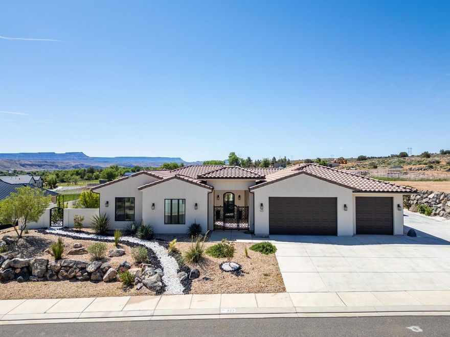 Overlooking open pastures, vibrant plateaus, and starry skies, life slows down the moment you step into this stunning custom home. Set on nearly half an acre with no HOA, peace and quiet abound effortlessly here.  

Inside, you're greeted with a welcoming single level floorplan complete with wood-beamed ceilings, bright LVP flooring, and windows that perfectly frame every view. Entertain in the large chef's kitchen featuring functional pullout drawers and a hidden pantry. Wake up to breathtaking views from the primary bedroom. Relax in the spa-like bathroom with a soaker tub, shower, and spacious closet.

The detached casita functions as a fully independent living space with its own kitchen, living area, and bedroom--ideal for guests, multigenerational living, or your own private retreat.

Outdoors, a private pool with a slide anchors the backyard, complemented by an outdoor fireplace and open areas designed for relaxation and stargazing. Low-maintenance turf keeps upkeep simple, while a dedicated RV pad adds practical space for additional vehicles or recreational use.

This home is a hard to find combination of serenity, versatility, and luxury.