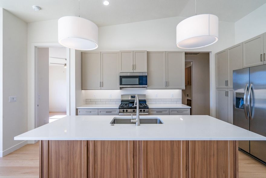 The Aurora showcases refined design and modern elegance in a thoughtfully crafted floor plan ideal for primary living, second-home use, or investment potential. This 2-bedroom, 2-bath residence features a sophisticated open-concept layout connecting the kitchen, dining, and great room, creating a seamless space for entertaining and everyday comfort. The primary suite offers a private bath and walk-in closet, while the secondary bedroom is positioned for enhanced privacy, ideal for guests or a home office. Abundant natural light, contemporary finishes, and optional outdoor living upgrades elevate the home's appeal. Community amenities include a resort-style pool, BBQ area, and playground coming soon. Builder warranty included. Home must be under contract by January 15, 2026 to qualify at this pricing. Builder offers no upgrade costsall finishes and features shown are included as the builder's standard. Every detail comes upgraded, providing exceptional value with premium selections already built in.