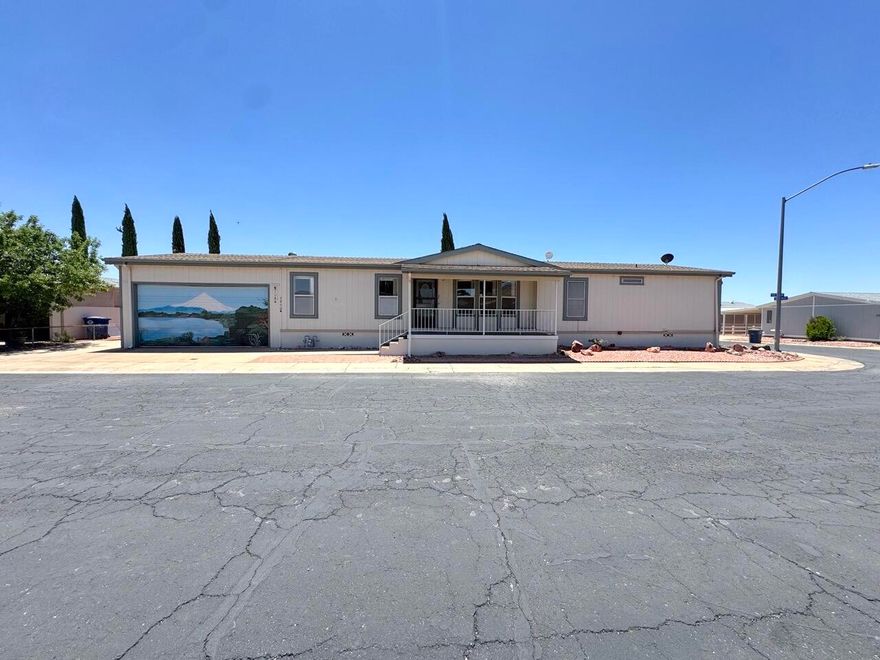 This charming home in the 55+ Lava Bluff community offers spacious living areas with a large family room, living room and open dining area. 3 large bedrooms with 2 bathrooms. Big covered porch in the back leads to a carport and 2 car garage! A full work shop is also attached to the garage. Situated on a corner lot, the property has great frontage and open views.