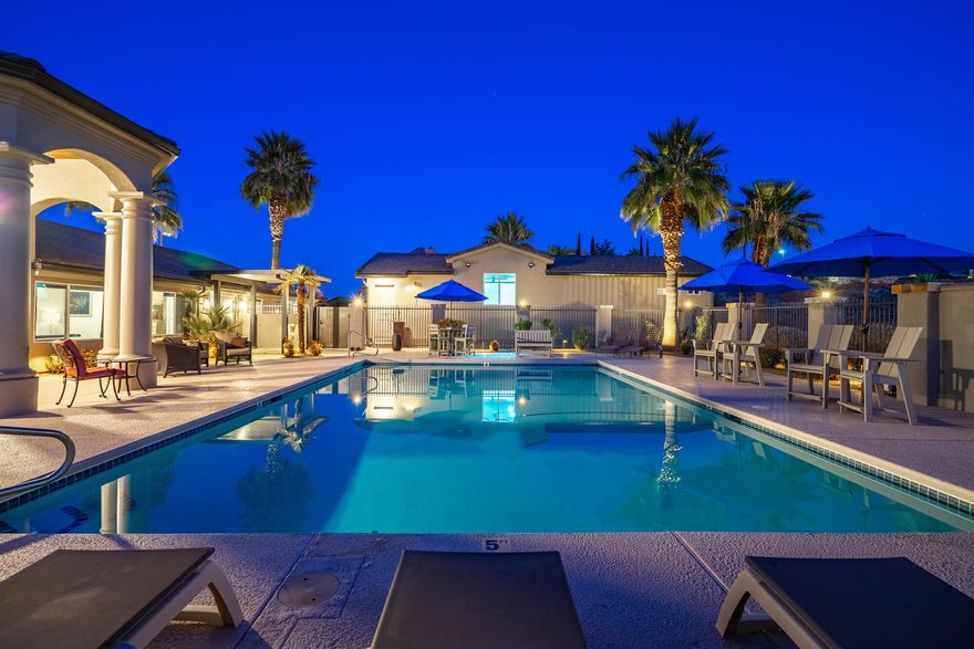 This home sits on over an acre of beautifully positioned land.  This exceptional property offers space, privacy, and resort-style amenities, with mature palm trees. Enjoy stunning views of Pine Mt. out the front and sparkling city lights and Red Cliffs Temple out the back. All from the comfort of your own home. For the active life style, this property features two quality built pickleball courts designed for serious play or casual play with family and friends. Just steps away, is an extra large pool that you can swim, or relax in to unwind, complete with its equipment housed in a dedicated enclosed room for convenience and protection. A well appointed pool bath with sink, shower, and toilet , just steps away from the spa.  1/2 bath on side of garage, specifically for the pickleball courts. Car enthusiasts and hobbyists will appreciate the 2 car garage and smaller RV garage.  Plenty of room for recreational toys or storage. Epoxy floors and special lights and painted perfectly for a man or woman cave. A MUST SEE!  Attached to the garage is a charming casita-perfect for guests, extended family or a private office. Inside the home is custom black walnut cabinets which offers abundant storage through out. Many custom lights, tiles, and counter tops. This property truly delivers a rare opportunity to own a private estate designed for living well. (Owner is a licensed real estate agent)