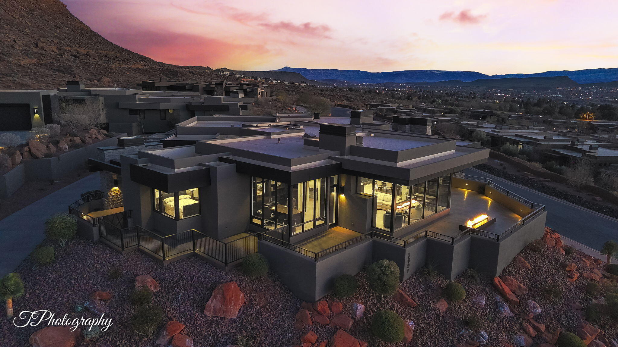 This exceptional home is a masterpiece of superior craftsmanship and intentional design, elevated above the street to maximize views & ensure ultimate privacy. Every room is positioned to showcase stunning panoramic views of the Red Mountains, Entrada Golf Course & city lights. Built w/ ultra-high-end features including air purification, smart lighting, & advanced security, seamlessly blends luxury with state-of-the-art technology. Neutral tones & finishes create a timeless aesthetic. Additional highlights include a professional chef's kitchen, butler's pantry, spa room opens to patio with panoramic views. Select furnishings may be available. Equity Membership is available, allowing buyers to bypass current waitlist & enjoy exclusive golf privileges upon closing. BY APPOINTMENT ONLY Guard at Gated Entry. Entrada membership (Associate or Equity) is required and gives access to the community's world-class amenities. 
Associates= $235/mo plus $800 food minimum at the restaurant. Golf with Equity membership is $1,200/mo plus $800 food minimum. 
Shown by appointment only. Homes of this caliber, with such meticulous attention to detail, superior construction, energy efficiency, and luxurious finishes, are truly one of a kind. Don't miss the opportunity. TAXED AS SECOND HOME. Tour: tphotography.aryeo.com/videos/0194cc5b-4512-736a-8bcb-b8c8d81d9bc3