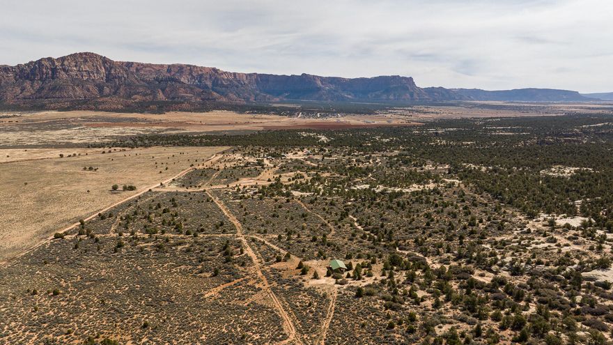 20 acres of prime off-grid land in Apple Valley, Utah, with breathtaking views of the Red Cliffs, Zion National Park, and Pine Valley Mountain. This unique property offers 1.98 acre-feet of water rights and the potential to run on solar power, providing the perfect balance of self-sufficiency and modern convenience. The gently rolling terrain features a slight slope, enhancing the panoramic views and creating an ideal setting for a custom home, hunting retreat, horse property or more. Despite its off-grid status, the property is located just minutes from restaurants, grocery stores, and the heart of town, making it easy to enjoy both privacy and accessibility. The surrounding area is rich in outdoor recreation opportunities, with nearby trails perfect for horseback riding and hunting. Whether you're looking to build a vacation getaway, a private homestead, or a base for exploring Utah's stunning landscapes, this property offers endless potential. Don't miss the chance to own a piece of Utah's natural beauty. Contact us today for more information or to schedule a private tour. buyer to verify all